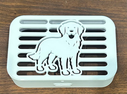 Close-up of golden retriever-shaped decorative downspout cover showing cover detail, Coastal Spouts design.