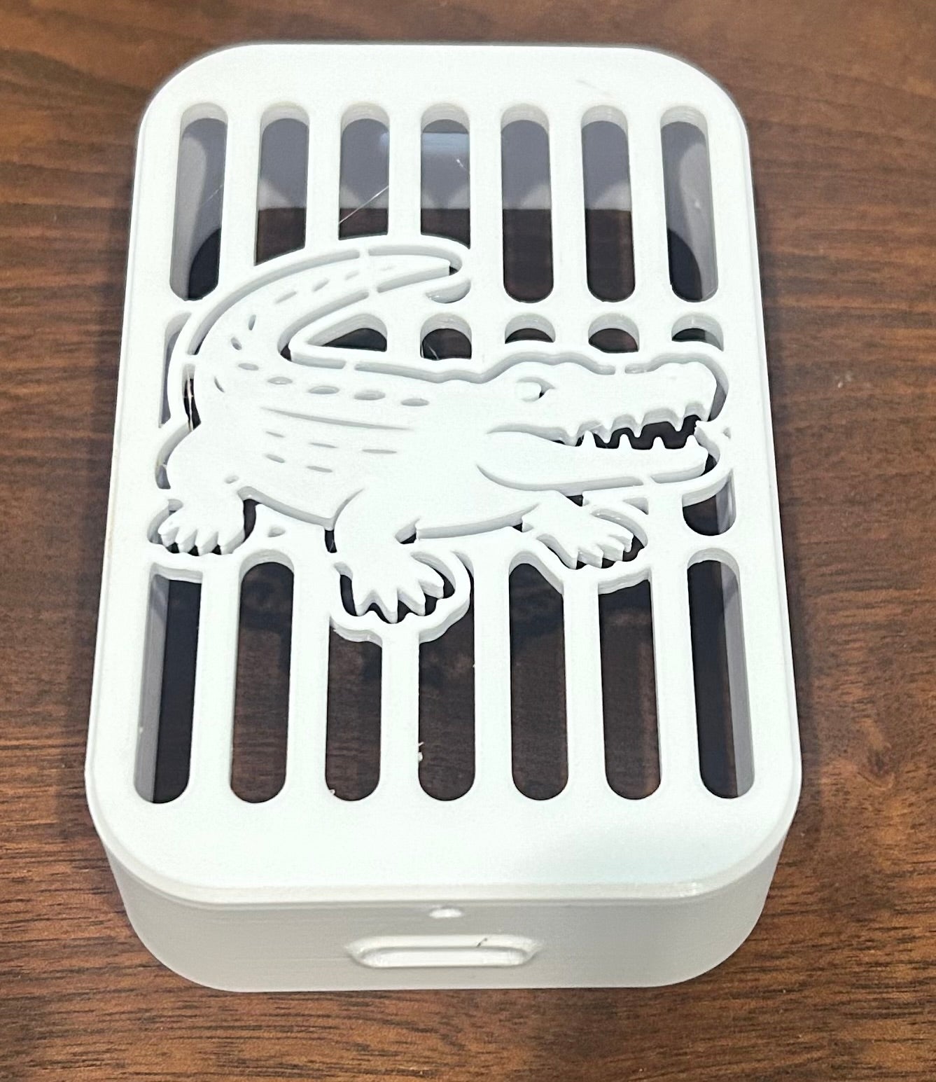 Alligator decorative downspout cover, swamp and coastal-themed gutter spout cap for unique outdoor drainage by Coastal Spouts.